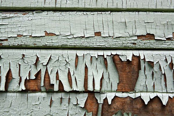 rotting wood siding showing ideal candidate for replacement with vinyl siding.