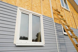 Picture of gray vinyl siding installation on Columbia home.